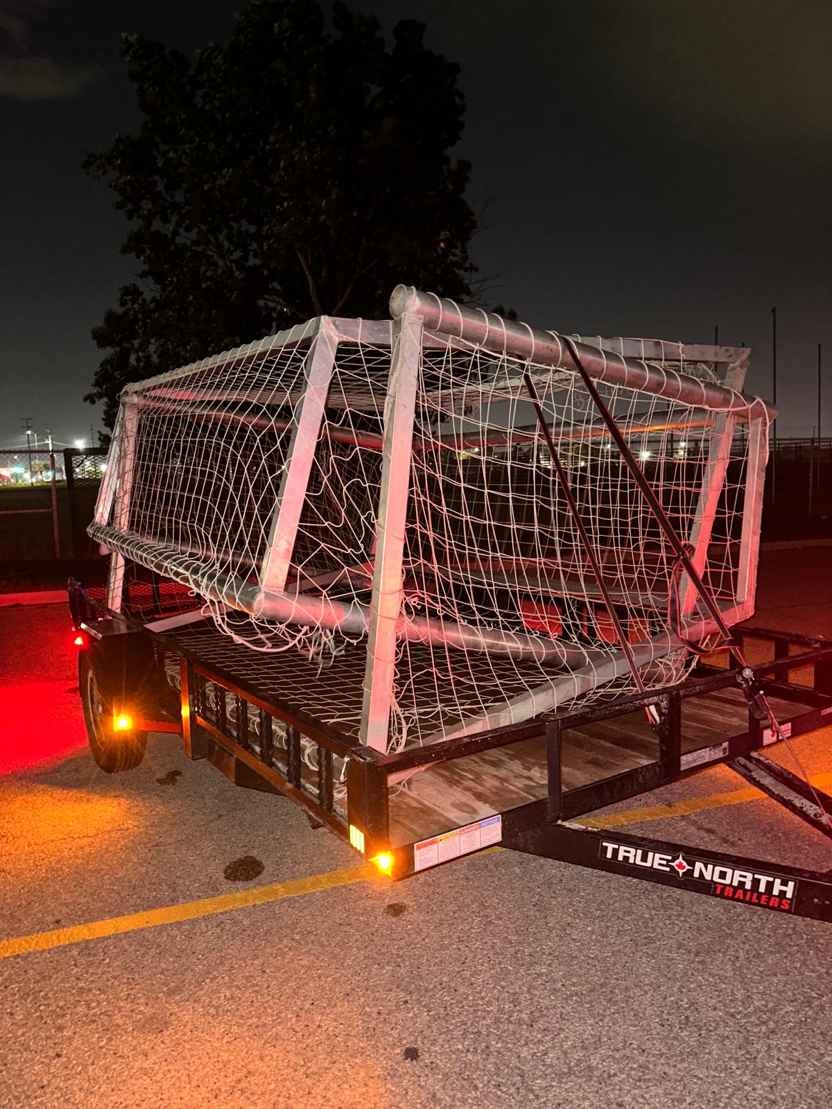 A trailer transporting soccer goal posts