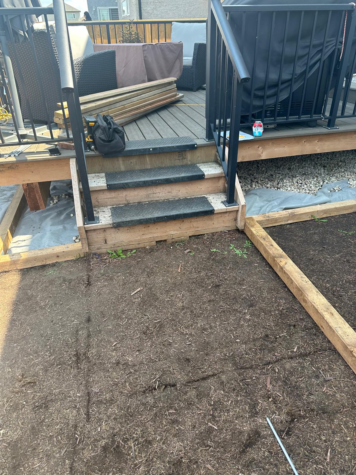 A backyard. Soil. No grass or lanscaping done yet.