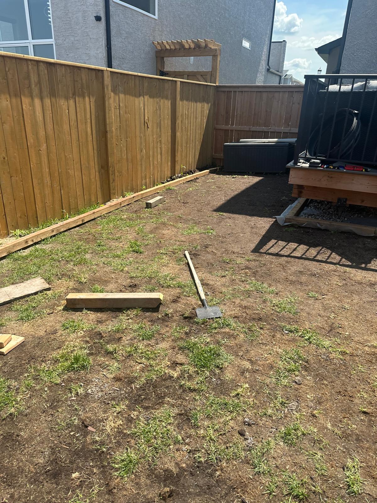 A backyard. Soil. No grass or lanscaping done yet.