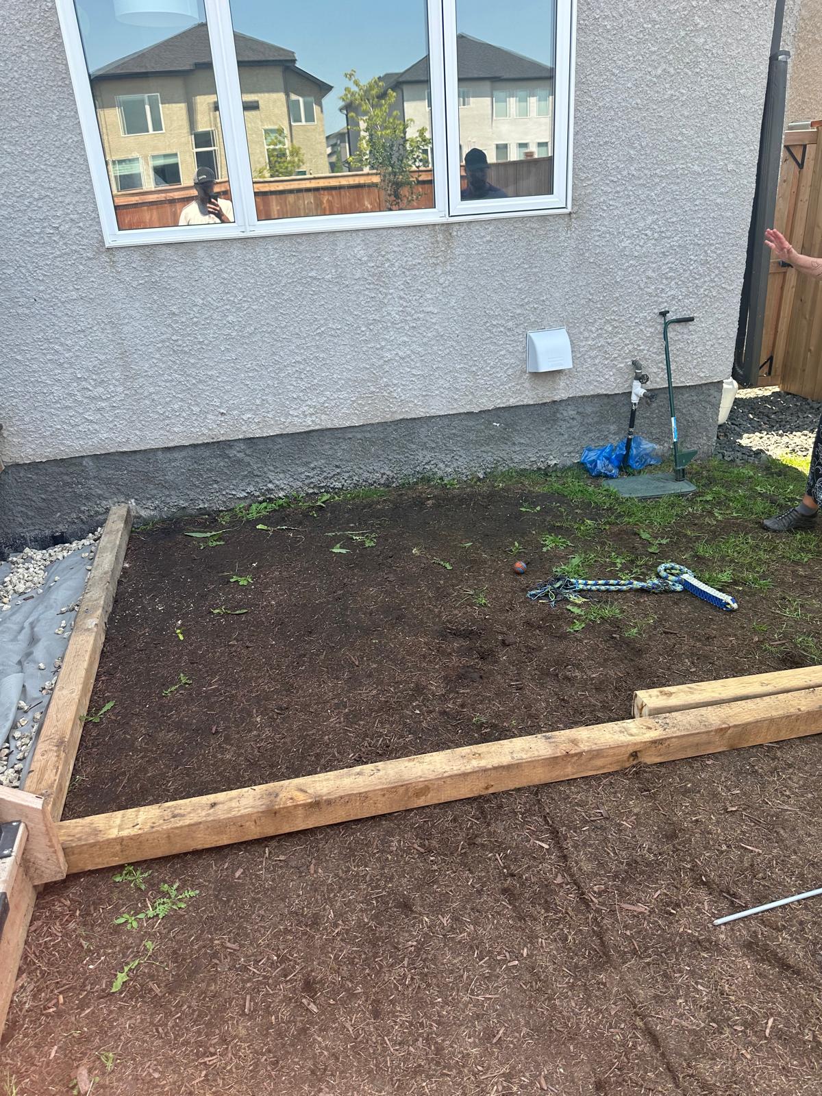 A backyard. Soil. No grass or lanscaping done yet.